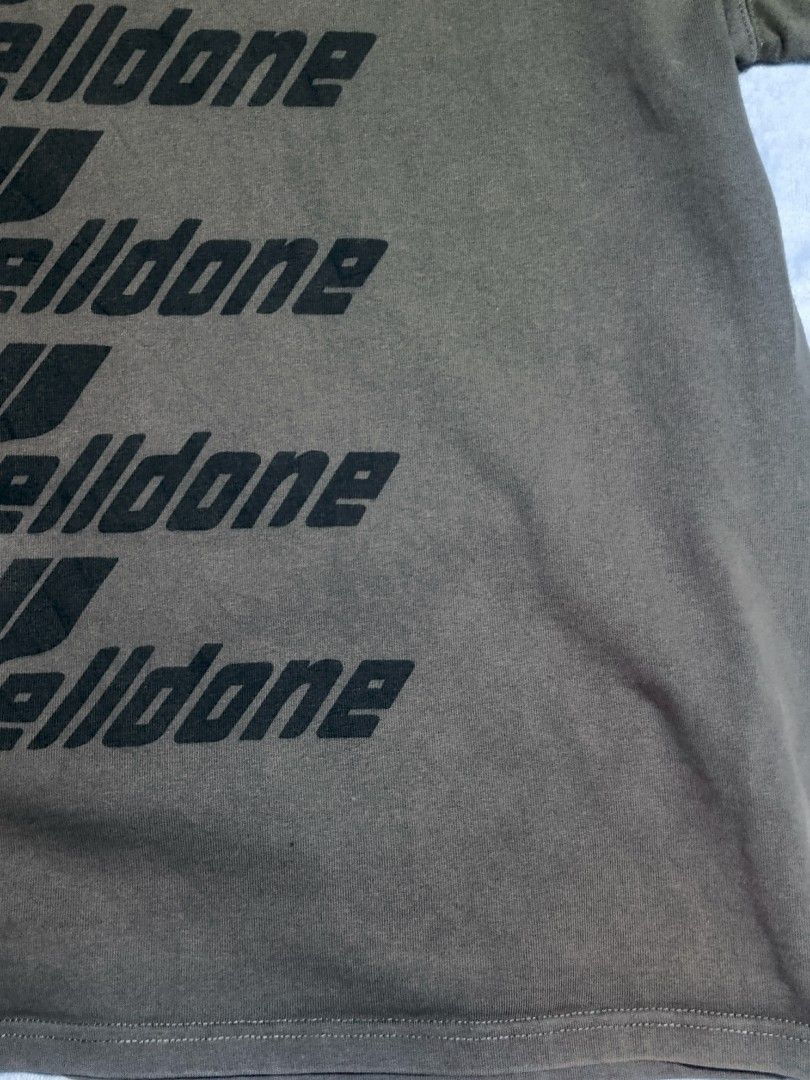 We11done Multi-Logo Grey T-Shirt (Category: Tshirts & Polo Shirts ) located in City of Isabela. Submitted by warmbird.d06e6f (Listing ID 1466849684, Image 2). Description: - Authentic Grey We11done crewneck t-shirt - Features repeated black logo graphics down the front - Soft cotton fabric with a stylish vintage wash effect - Includes original interior collar and resort collection tags - Standard short-sleeve cut with a relaxed streetwear fit - V