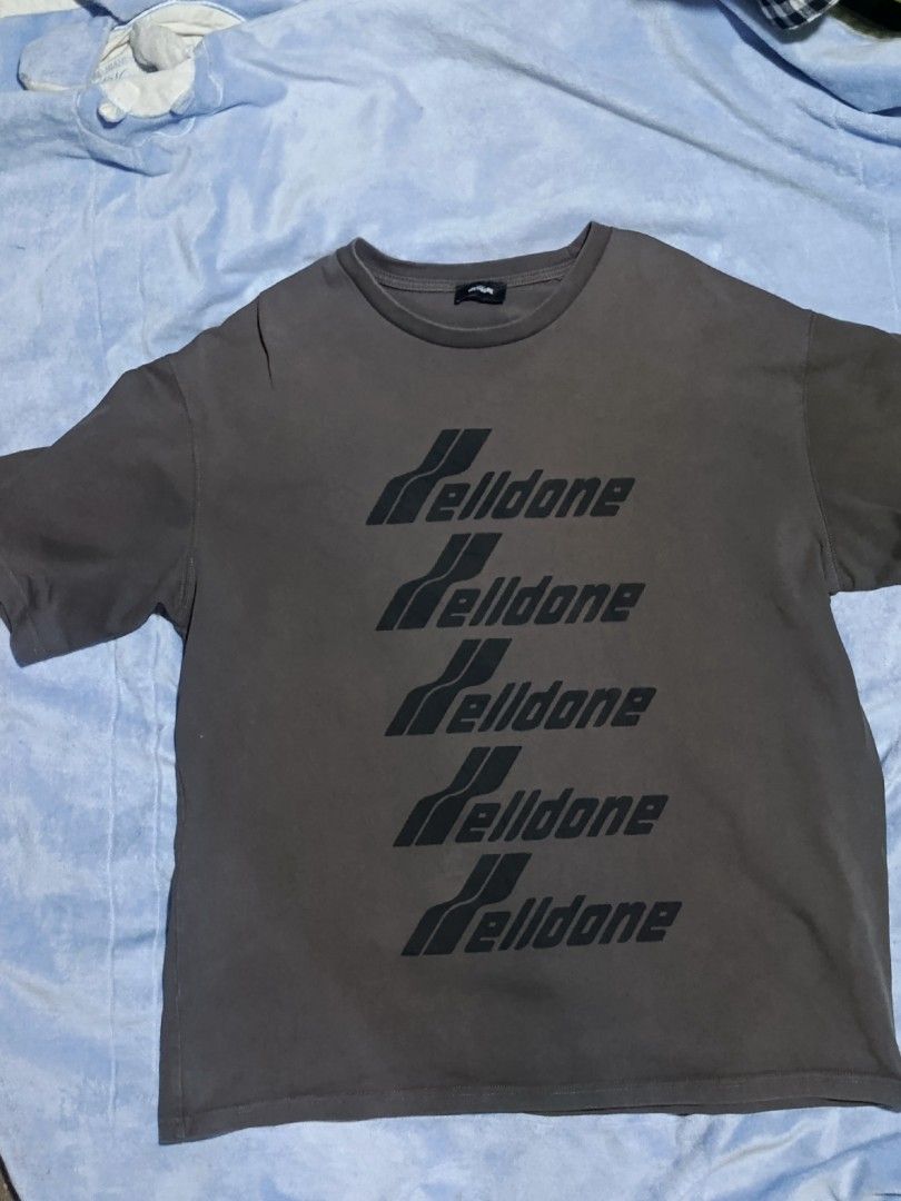 We11done Multi-Logo Grey T-Shirt (Category: Tshirts & Polo Shirts ) located in City of Isabela. Submitted by warmbird.d06e6f (Listing ID 1466849684, Image 1). Description: - Authentic Grey We11done crewneck t-shirt - Features repeated black logo graphics down the front - Soft cotton fabric with a stylish vintage wash effect - Includes original interior collar and resort collection tags - Standard short-sleeve cut with a relaxed streetwear fit - V