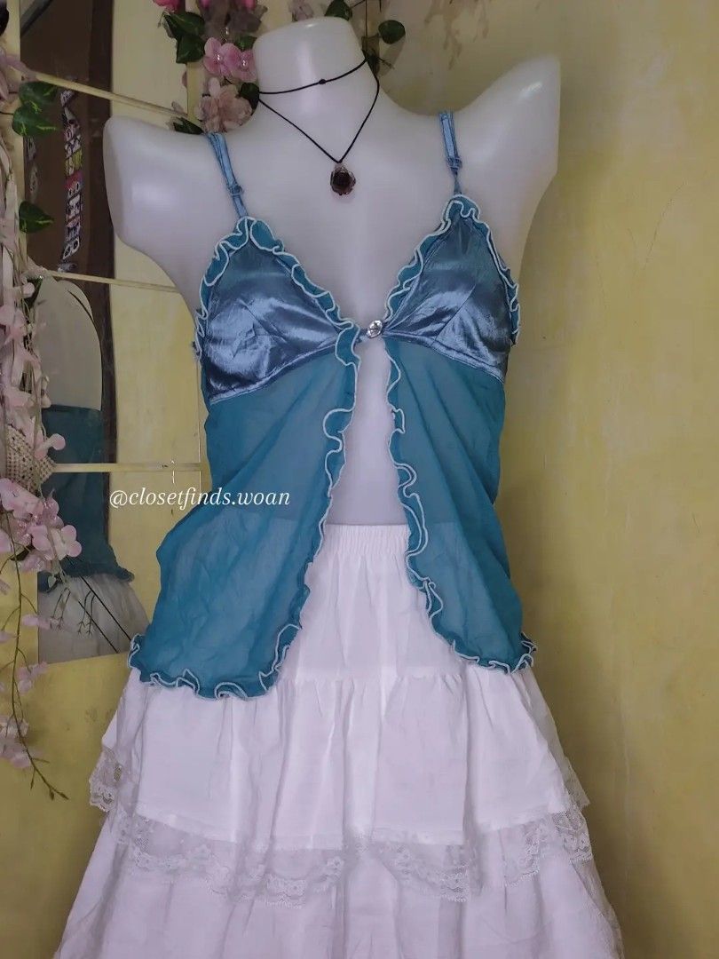 Whimsy Top (Category: Sleeveless) located in Manila. Submitted by woaannn (Listing ID 1466859040, Image 1). Description: -xs-small size -flaw on strap (run) -adjustable straps -see through except chest part -one working button.