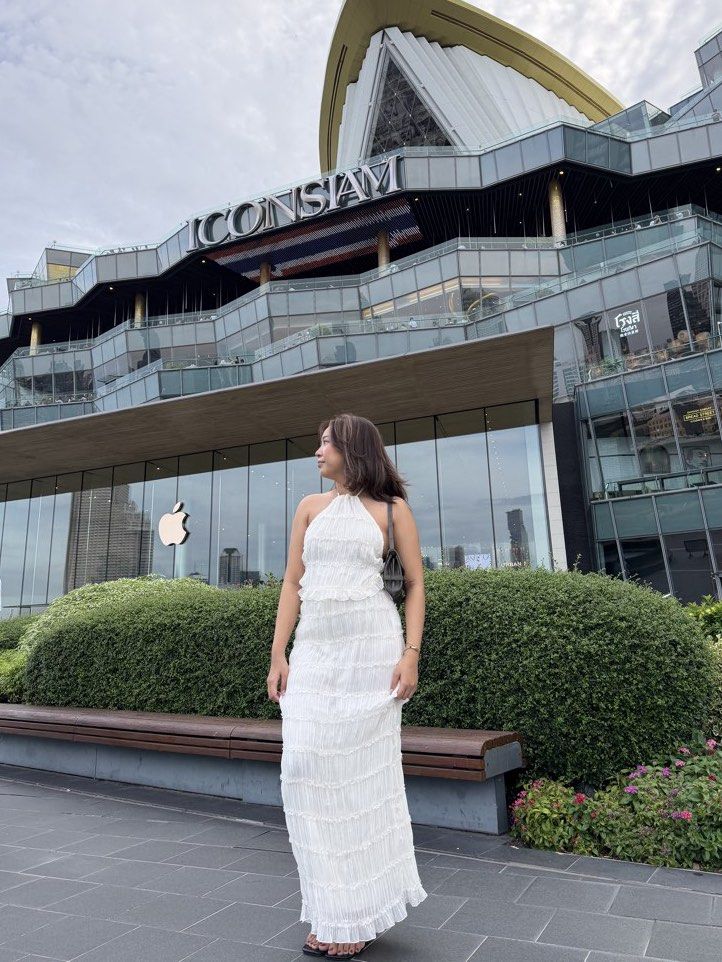 White Halter Neck Ruffle Maxi Dress (Category: Dresses) located in Pasig City. Submitted by settey (Listing ID 1466910233, Image 3). Description: - Color/Style: White halter neck maxi dress - Material: Lightweight crinkled fabric - Details: Tiered ruffle layers, floor-length fit - Condition: Worn once, excellent (no stains or loose threads) - Best for: Vacations, beach trips, or evening dinners.