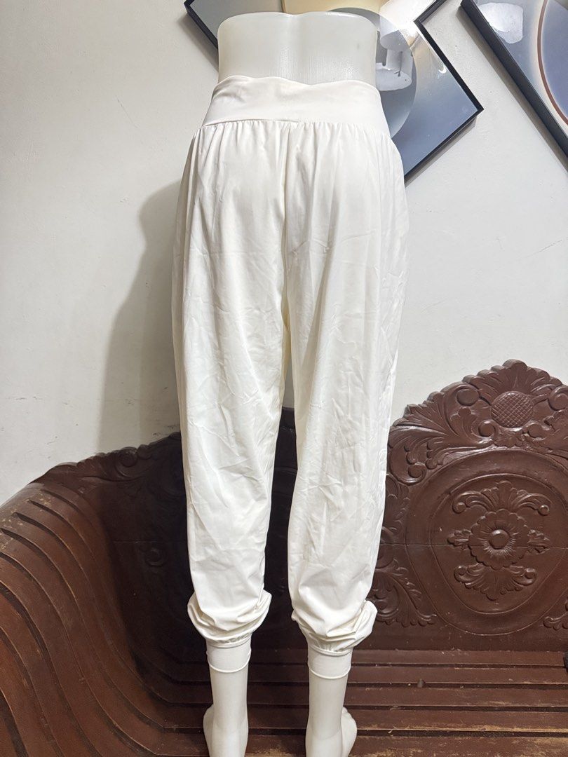 White High-Waisted Cuffed Jogger Pants (Category: Jeans) located in Marikina City. Submitted by lorradel (Listing ID 1466808344, Image 3). Description: - fits 27-29 in waist - Color: White - Fit: Relaxed through hips and thighs with tapered, cuffed ankles - Waist: Wide, high-waist band with easy pull-on style - Fabric: Soft and lightweight for all-day comfort - Details: Subtle reflective tape near the left hem - Best for: Lounging, errands, or li