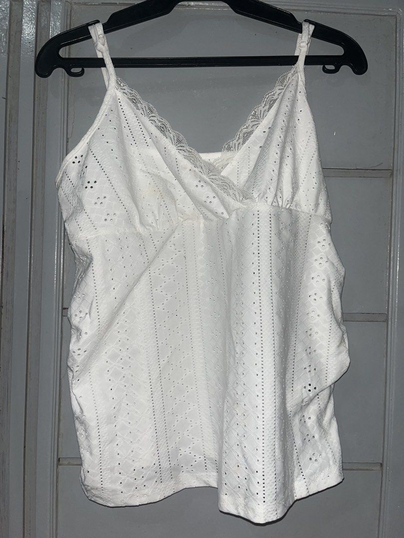 White lace trim camisole eyelet top (Category: Sleeveless) located in Mandaluyong City. Submitted by yujee (Listing ID 1466797728, Image 1). Description: 📍 Mandaluyong - White, lace trin, eyelet pattern top - like new (yellow stains but washable) - MOP: GCash - lalamove around Metro Manila .