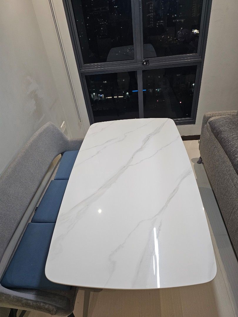 White Marble Pattern Dining Table (Category: Tables & Sets) located in Singapore. Submitted by mummyiren (Listing ID 1466928362, Image 1). Description: - White dining table with stylish sintered stone top - Sturdy black metal cross legs and flat rectangular base for maximum stability - Modern minimalist design, perfect for contemporary homes - Clean surfaces with minimal signs of wear.