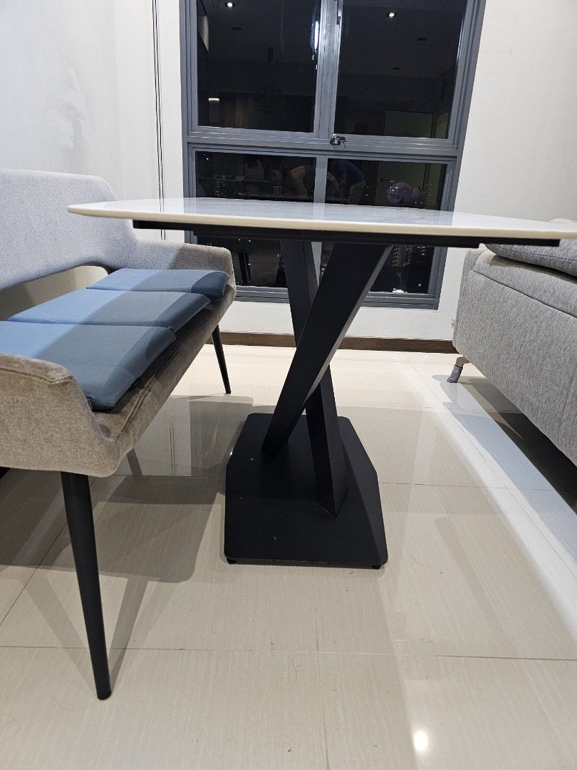 White Marble Pattern Dining Table (Category: Tables & Sets) located in Singapore. Submitted by mummyiren (Listing ID 1466928362, Image 2). Description: - White dining table with stylish sintered stone top - Sturdy black metal cross legs and flat rectangular base for maximum stability - Modern minimalist design, perfect for contemporary homes - Clean surfaces with minimal signs of wear.