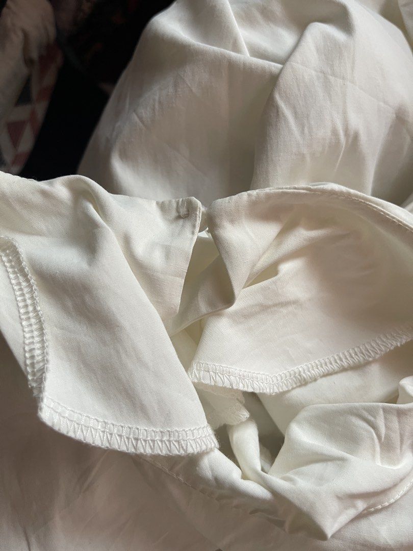 White Puff Sleeve Blouse (Category: Blouses) located in Toledo. Submitted by klnmia (Listing ID 1466863545, Image 2). Description: - Color: Classic White - Design: Dramatic voluminous puff sleeves with a round neckline - Fit: Relaxed, boxy cut through the body - Material: Lightweight, breathable woven fabric - Finish: Clean finished hems inside and out - Styling: Versatile piece, easy to pair with casual trousers or skirts.