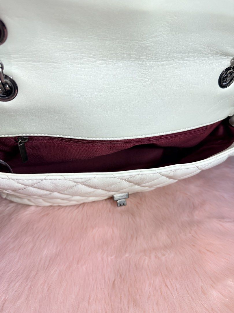 White Quilted Shoulder Bag with Chain Strap (Category: Shoulder Bags) located in Quezon City. Submitted by shaberbree (Listing ID 1466912932, Image 2). Description: - Color: Classic white with a luxurious quilted design - Material: Soft-touch exterior with durable dark burgundy fabric lining - Closure: Secure flap with a chic dark metallic turn-lock clasp - Strap: Edgy and versatile gunmetal chain handles - Storage: Includes one interior zippered