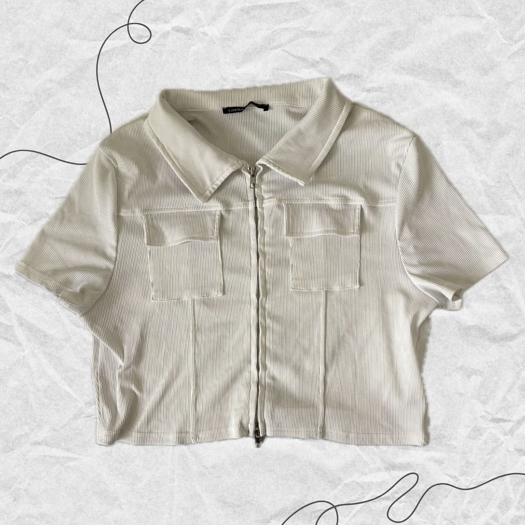 White Two-Way Zip Cropped Polo (Category: Others Tops) located in Manila. Submitted by lovedbydeviii (Listing ID 1466850392, Image 1). Description: White Two-Way Zip Cropped Polo 🧵Php 100 👗Size: Freesize 👗Slightly used but in very good condition * note that color may slightly vary due to lighting .