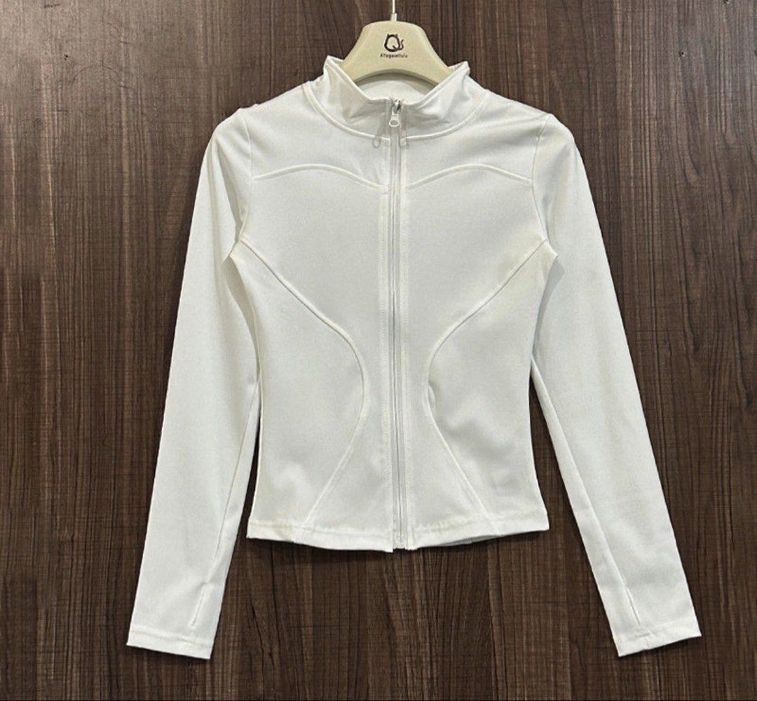 White Zip-Up Athletic Jacket with Thumbholes (Category: Activewear) located in Pasig City. Submitted by deedee235 (Listing ID 1466882849, Image 1). Description: Has stain on left chest (see last photo).