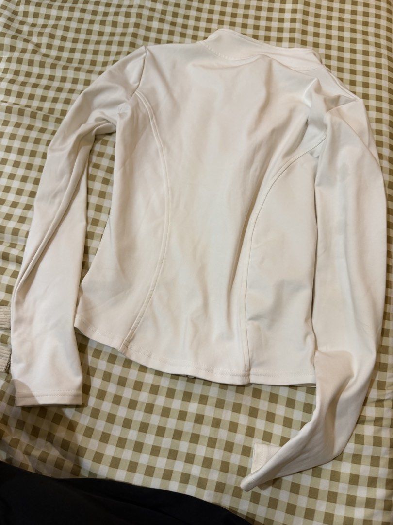 White Zip-Up Athletic Jacket with Thumbholes (Category: Activewear) located in Pasig City. Submitted by deedee235 (Listing ID 1466882849, Image 3). Description: Has stain on left chest (see last photo).
