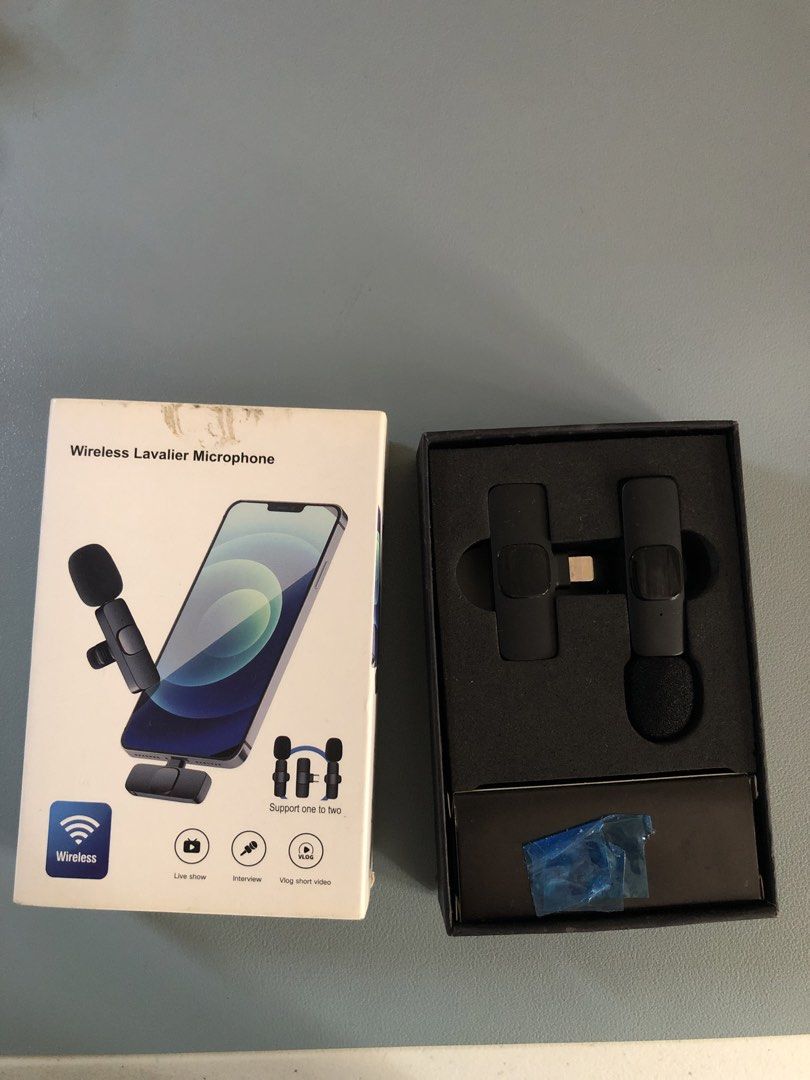 Wireless Lavalier Microphone for iPhone (Category: Microphones) located in Makati City. Submitted by julieees.closet (Listing ID 1466848881, Image 1). Description: - Dual wireless clip-on microphones and Lightning receiver for iPhone - Ideal for vlogging, live streaming, and interviews - Includes charging cable in the box - Unused condition (original box has minor wear on top) - Complete set in original packaging Lmk if u have any qs!.