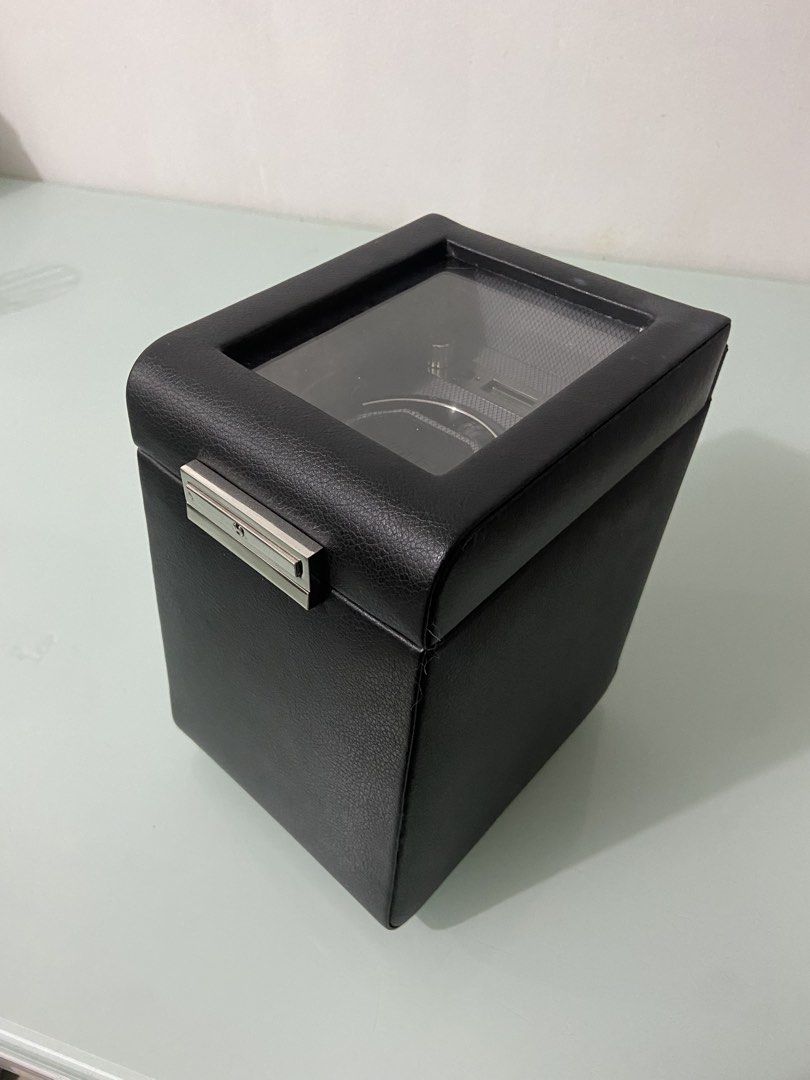 Wolf Viceroy Single Watch Winder Black 456002 (Category: Men's Watches) located in Makati City. Submitted by mightybear_3ac45c (Listing ID 1466963380, Image 2). Description: - Wolf Viceroy single watch winder in classic black -Luxary - Keeps automatic watches precisely wound and ready to wear - Premium pebbled leather finish with textured interior lining - Features a clear display window on top and digital settings screen inside - Powered by incl