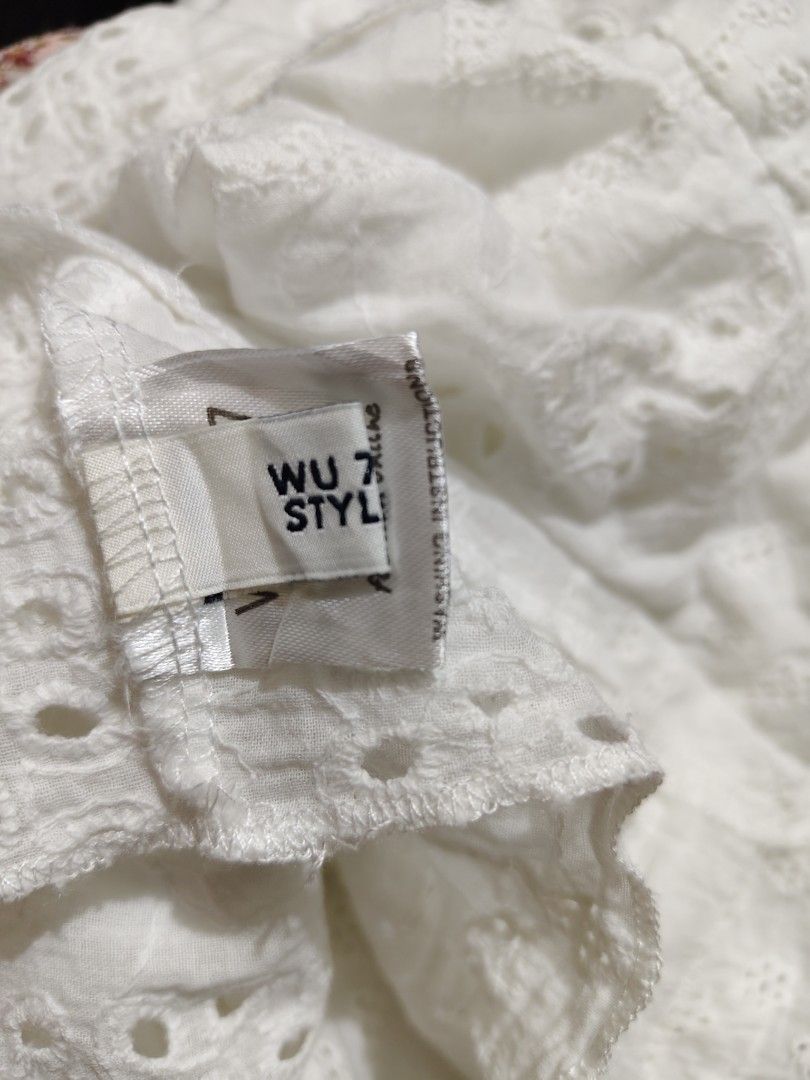 WW 77 STYLE White Eyelet Top (Category: Blouses) located in Manila. Submitted by chynii_28 (Listing ID 1466867572, Image 2). Description: - Brand/Style: WW 77 STYLE white eyelet top - Condition: 10/10, zero flaws found on fabric - Fit: Bust 28 to 34 inches, waist up to 32 inches - Features: Adjustable spaghetti straps, sweet ruffled neckline, and front tie ribbon - Details: Layered ruffle hem with intricate cut-out patterns throughout - Perfect f