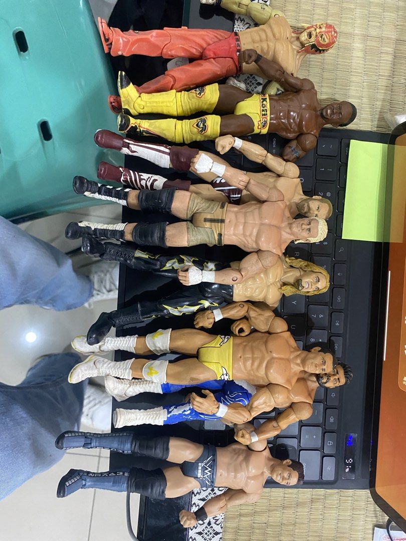 WWE Wrestling Action Figures Bundle Toy Lot (Category: Action & Battle Toys) located in Manila. Submitted by curlcyspreloved (Listing ID 1466886850, Image 2). Description: - Lot of WWE wrestling action figures - Features various wrestlers in different ring gear, knee pads, and boots - Colorful mix of characters in yellow, red, black, and blue outfits - Minor paint wear on some figures due to previous play - Great bundle for fans and collectors.