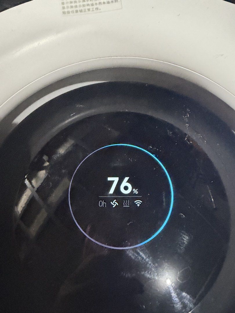 Xiaomi Mijia Pure Smart Humidifier (Category: Air Purifiers & Dehumidifiers) located in Bulacan. Submitted by mysticdeer.6d7f47 (Listing ID 1466876172, Image 3). Description: The device in the image is a Xiaomi Mijia Pure Smart Humidifier (such as the Pro or Mist Free series), featuring a cylindrical white body, a top-mounted circular OLED display panel, and touch-sensitive control buttons. • Type: Evaporative (mist-free) smart humidifier • Key F
