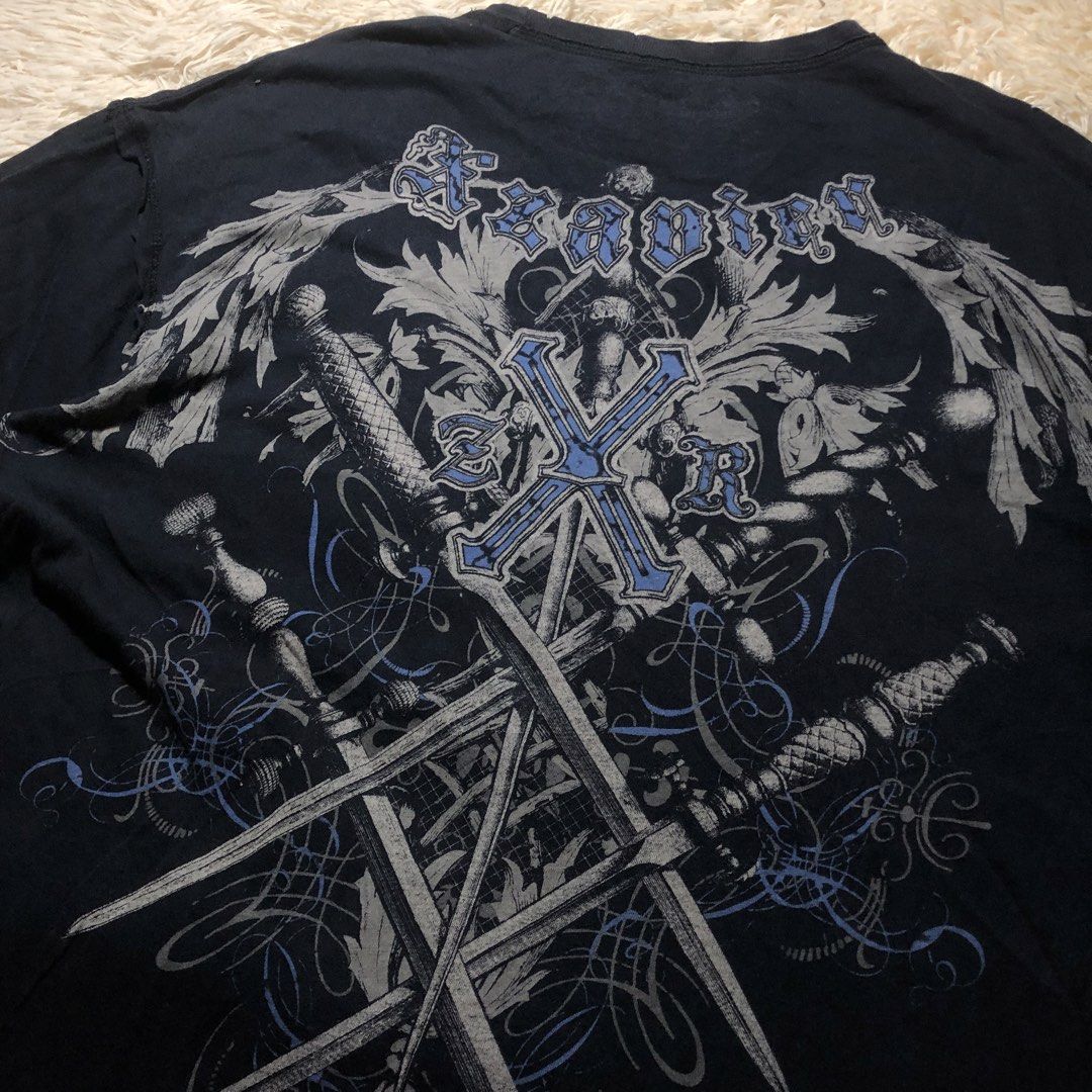 Xzavier Grunge Tee (Category: Tshirts & Polo Shirts ) located in Maria Aurora. Submitted by kylerikathriftshop101010 (Listing ID 1466923998, Image 3). Description: 24 x 29 some bleach stains(on pic)- Brand/Model: Xzavier black short-sleeve tee - Size: 2XL - Material: 100% combed cotton (Made in Guatemala) - Design: Large crossed swords and filigree graphics on the back, matching ornate cross and swirl design on the front chest - Comfort: Tag prin