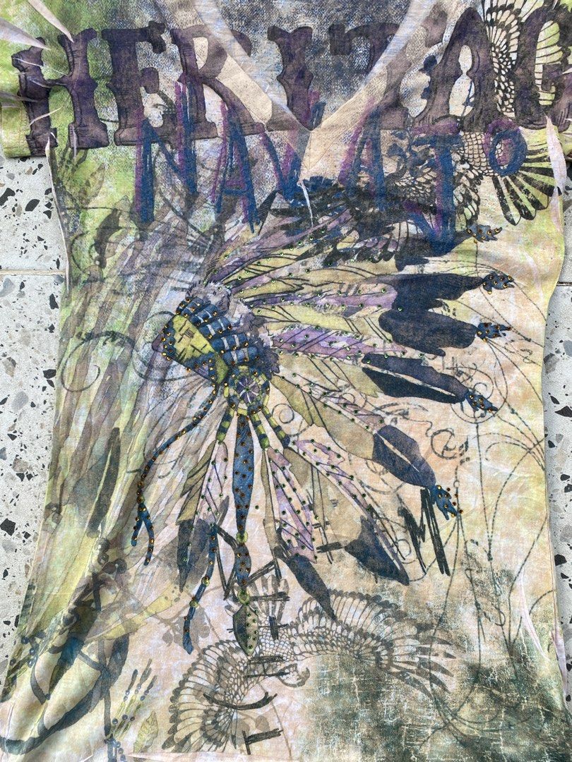 Y2k Grunge baby Tee (Category: Blouses) located in Bulacan. Submitted by badass.thrift.finds (Listing ID 1466874862, Image 3). Description: Y2k Grunge baby Tee Heritage native american w/ rhinestones design 15 width 27.5 length .