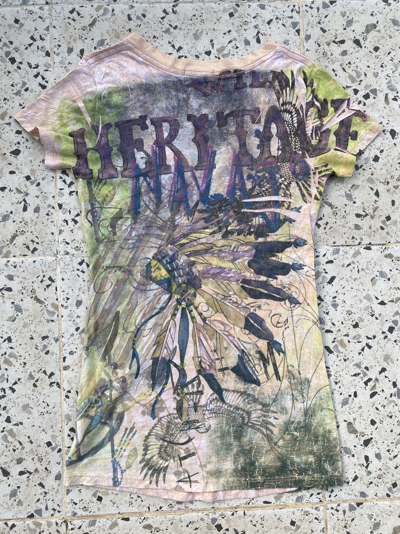 Y2k Grunge baby Tee (Category: Blouses) located in Bulacan. Submitted by badass.thrift.finds (Listing ID 1466874862, Image 2). Description: Y2k Grunge baby Tee Heritage native american w/ rhinestones design 15 width 27.5 length .