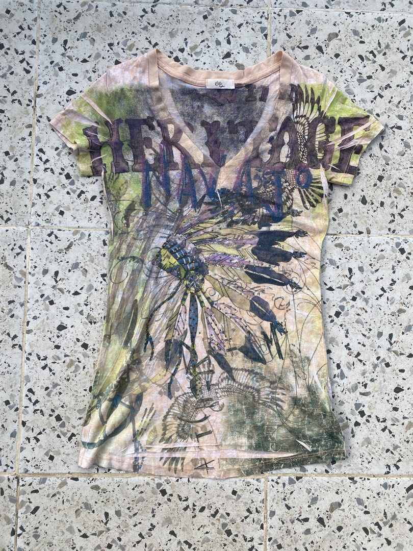 Y2k Grunge baby Tee (Category: Blouses) located in Bulacan. Submitted by badass.thrift.finds (Listing ID 1466874862, Image 1). Description: Y2k Grunge baby Tee Heritage native american w/ rhinestones design 15 width 27.5 length .