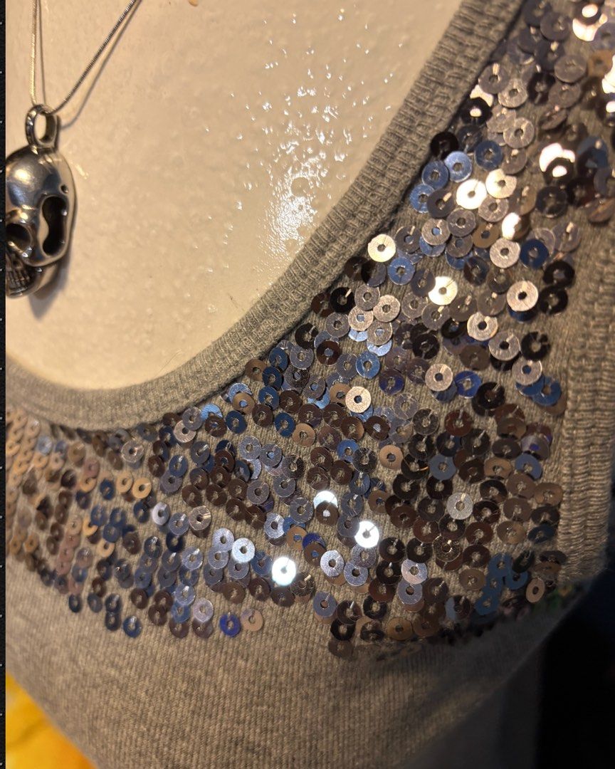 Y2K McBling Heather Grey & Silver Sequin Ribbed Tank Top (Category: Sleeveless) located in Quezon City. Submitted by zieliv (Listing ID 1466967783, Image 3). Description: DECLUTTERING! ☠️ Kindly read the description before inquiring. If interested, send me a message. Get or pass is appreciated. °+* For sale preloved items! *+° Mine now and pay within 24 hrs after invoice. ITEM DETAILS: • Style: Y2K / McBling Silver Sequin Panel Ribbed Scoop Neck 