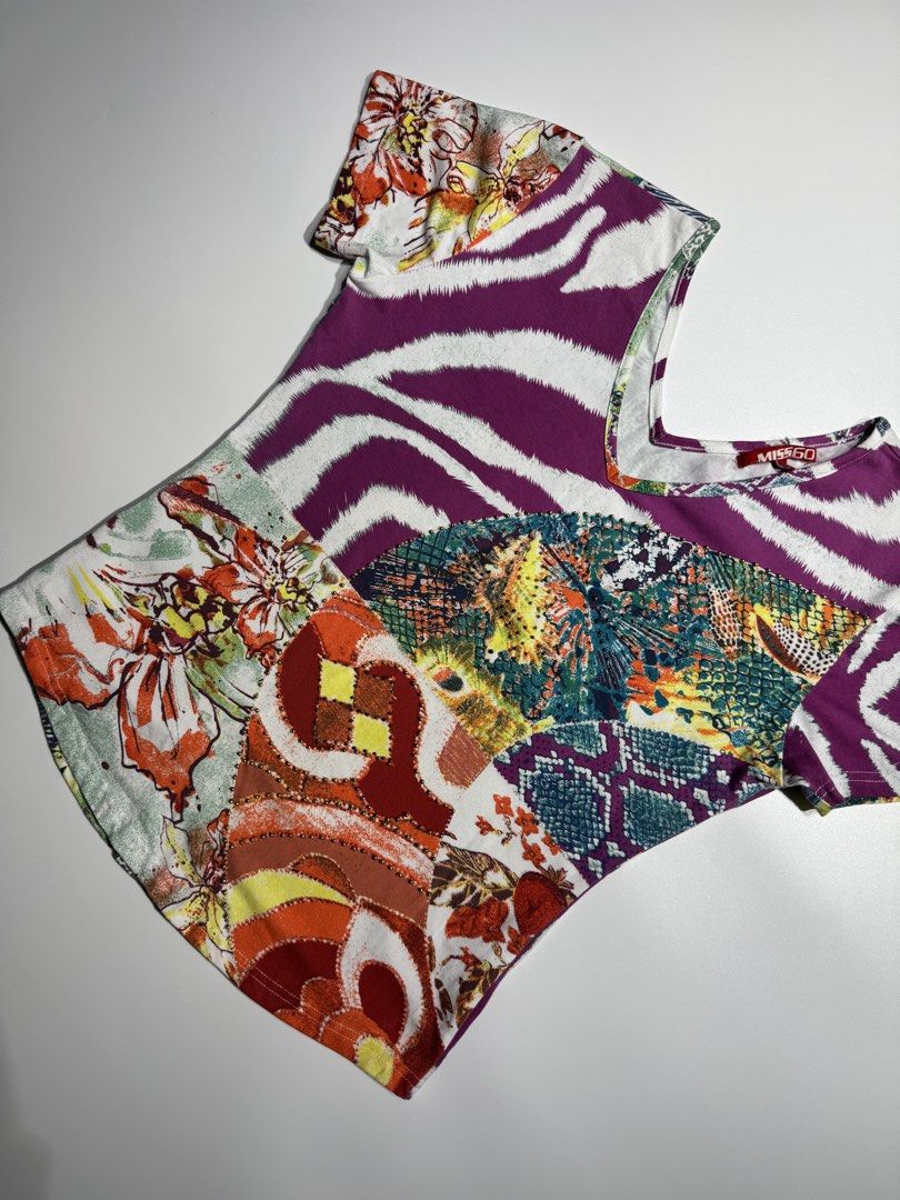 Y2K Miss Sixty Multi-Pattern Short Sleeve V-Neck Top Size S (Category: Shirts) located in Manila. Submitted by babygirly2k (Listing ID 1466836475, Image 3). Description: - Brand: Miss Sixty - Style: V-neck top with short sleeves - Design: Vibrant patchwork of animal, floral, and snake prints with delicate front stud embellishments - Fabric: Lightweight and stretchy - Size: Pit-to-pit approx. 18 inches - Condition: Great statement piece for casual