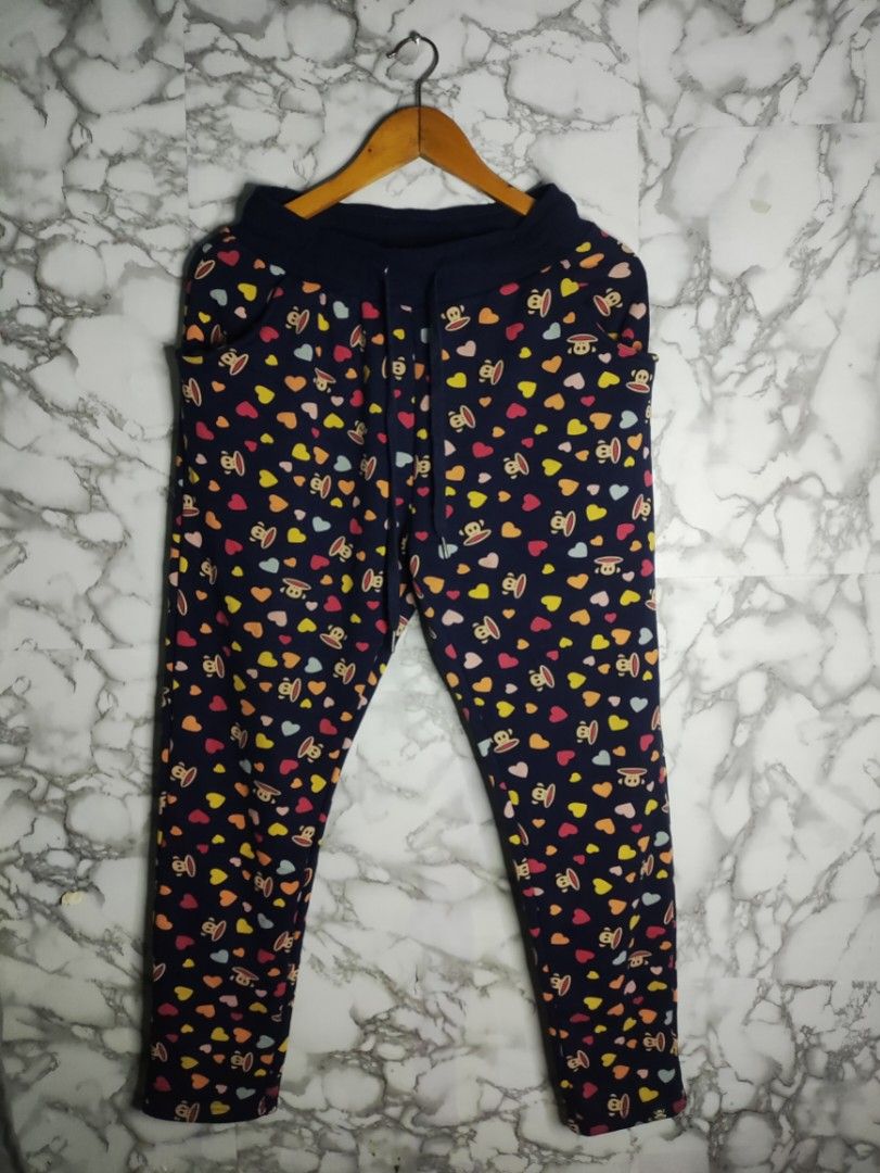 Y2k Paul Frank Pajama (Category: Joggers) located in Taguig. Submitted by althriftdailyloots94 (Listing ID 1466957757, Image 1). Description: - Brand/Design: Authentic Paul Frank with all-over monkey and colorful heart print - Color: Classic navy blue - Size: XL - Comfort & Fit: Elastic waistband with adjustable drawstring and practical front pockets - Condition/Origin: Made in Macau, dated 2014 - Perfect for: Cozy lounging and casual days.