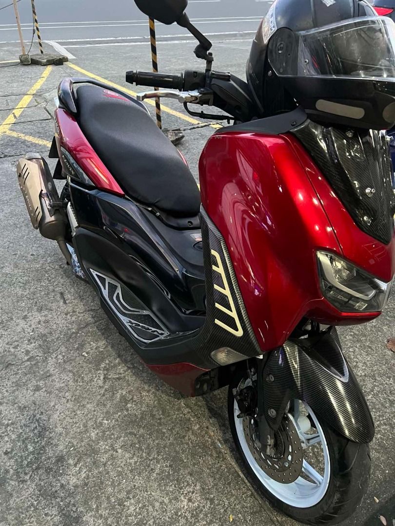 Yamaha NMax V2 2022 Model Red Scooter (Category: Motorbikes for Sale) located in Quezon City. Submitted by idyllicfinds (Listing ID 1466868768, Image 2). Description: New rear suspension TRC, with free LS2 Helmet (used) Negotiable for sure buyers Location: Don Antonio, Commonwealth Ave., Quezon City Call/Text here: 09972101717.