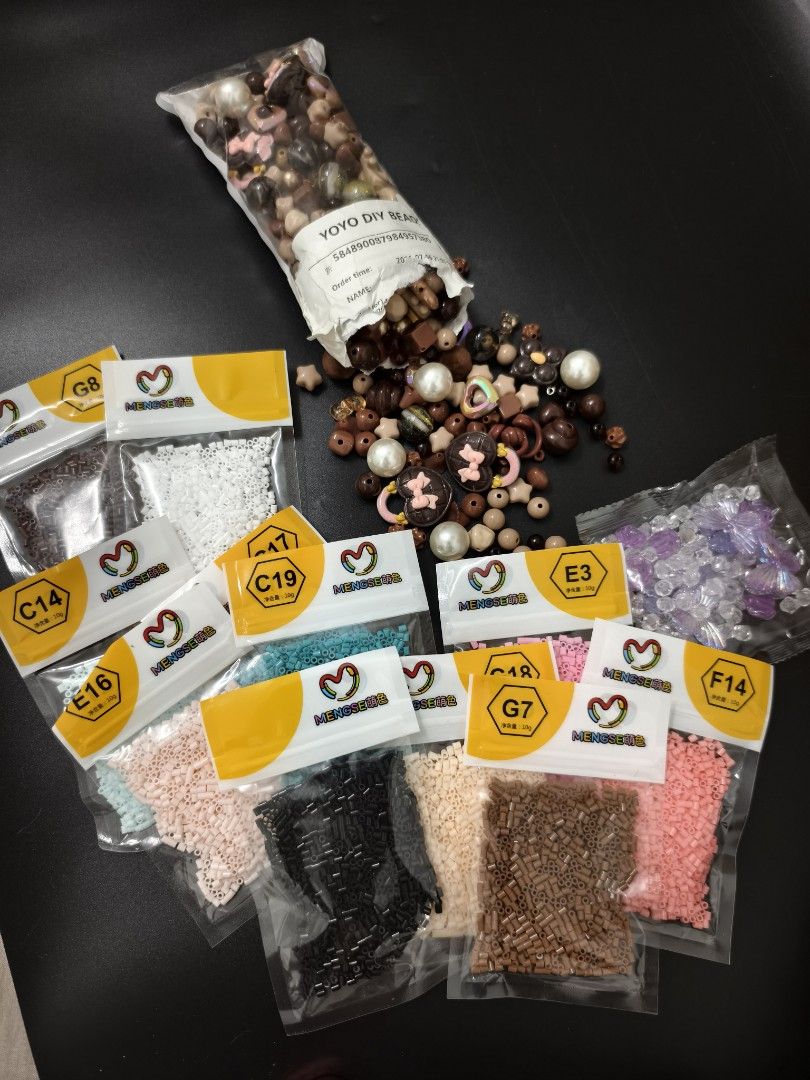 Yoyo DIY Bead Craft Set with Assorted Colors (Category: Craft Supplies & Tools) located in Angeles City. Submitted by measaliman02351 (Listing ID 1466857239, Image 3). Description: - Massive DIY crafting bead collection for all your creative projects - Includes one large bag of mixed charms, pearls, and brown beads - Comes with multiple small packets of perler fuse beads (approx. 10g each) - Solid colors include white, black, brown, pink, blue, a
