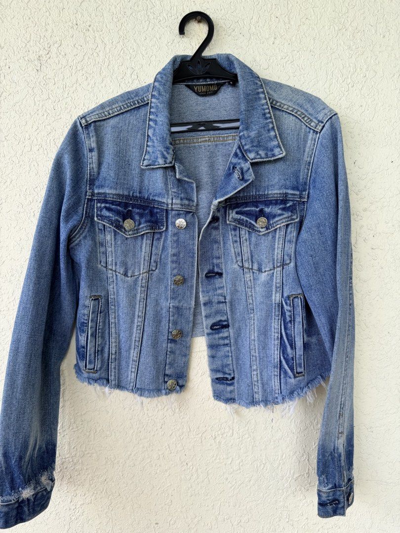 Yumomo Light Wash Cropped Denim Jacket (Category: Coats, Jackets and Outerwear) located in Tubigon. Submitted by gypsea.soulph (Listing ID 1466946941, Image 2). Description: - Brand: Yumomo - Wash: Light blue denim - Fit: Cropped, structured style with long sleeves - Details: Silver metal buttons and dual chest pockets - Hem: Trendy raw frayed hemline - Style: Great versatile layering piece.