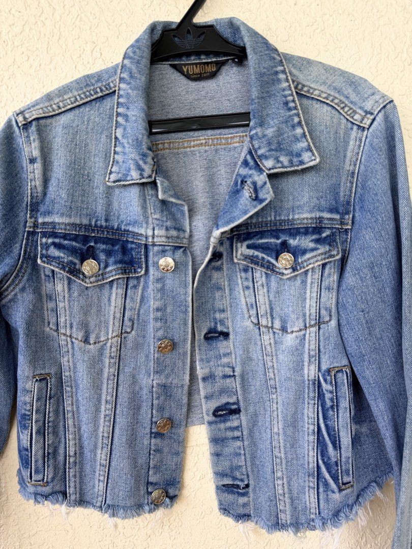 Yumomo Light Wash Cropped Denim Jacket (Category: Coats, Jackets and Outerwear) located in Tubigon. Submitted by gypsea.soulph (Listing ID 1466946941, Image 1). Description: - Brand: Yumomo - Wash: Light blue denim - Fit: Cropped, structured style with long sleeves - Details: Silver metal buttons and dual chest pockets - Hem: Trendy raw frayed hemline - Style: Great versatile layering piece.