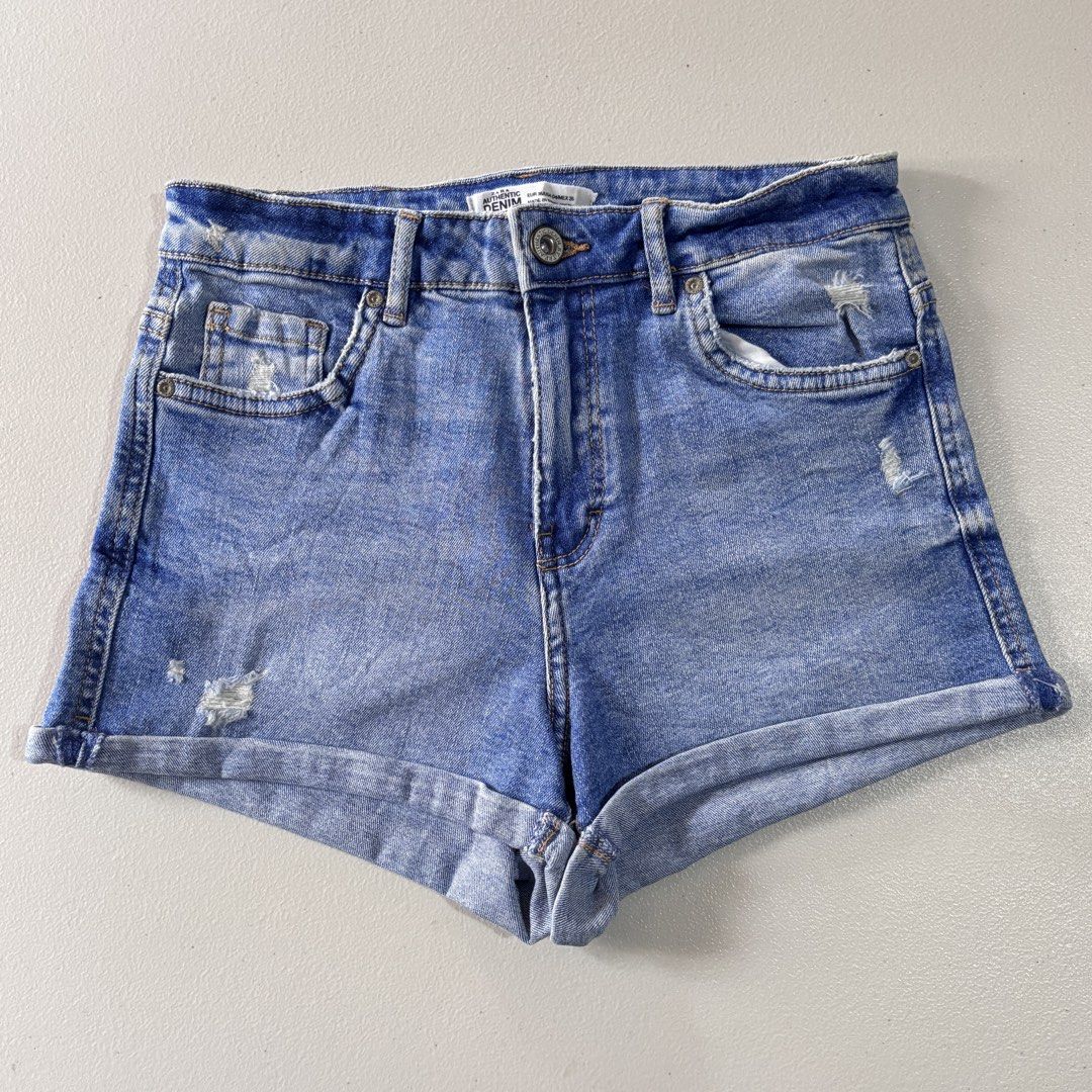 Zara Authentic Denim TRF Distressed Roll-Up Shorts (Category: Shorts) located in Guimba. Submitted by huenited (Listing ID 1466816816, Image 1). Description: - Brand: Zara (TRF line) - Style: Medium wash denim shorts with light distressing and rolled cuffs - Size: EUR 36 / USA 04 / MEX 26 - Closure: Button closure and zip fly - Condition: Great pre-loved staple piece for warm weather - Shipping: Ships fast from the Philippines.