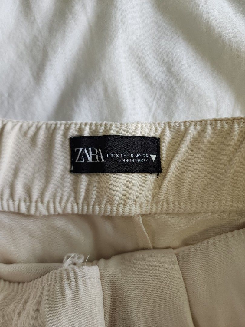 Zara Beige Tailored Shorts Size S (Category: Shorts) located in Cebu City. Submitted by groovefunknsoul (Listing ID 1466863619, Image 3). Description: - Brand: Zara - Color: Beige - Size: S (EUR S, USA S, MEX 26) - Origin: Made in Turkey - Design: Clean tailored look with front pleats and back pocket details - Style Tip: Easy to match with basic tops or blouses for a casual day out.