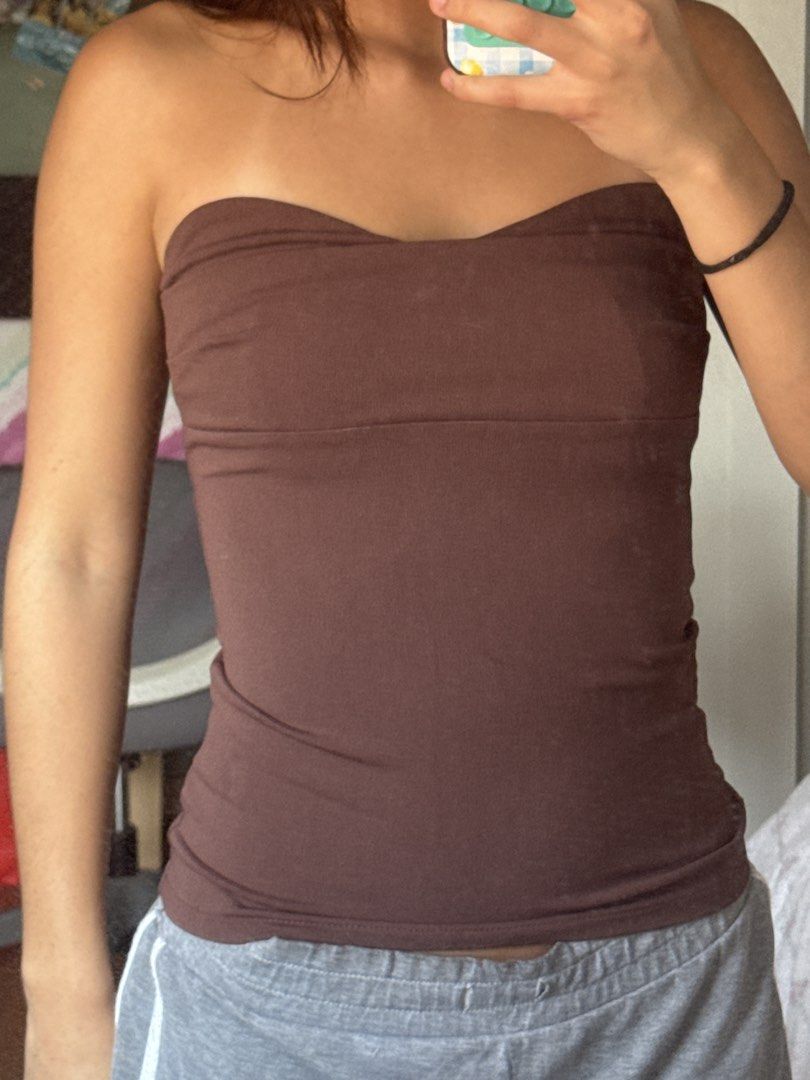Zara Brown Tube Top Size S (Category: Sleeveless) located in Manila. Submitted by chicclosetco (Listing ID 1466801464, Image 3). Description: - Brand: Zara - Style: Brown strapless tube top with a sweetheart neckline - Size: S (fits true to size) - Material: Stretchy, super comfortable, hugs the body nicely - Versatility: Easy to pair with jeans, sweatpants, or skirts - Condition: Worn once, practically brand new.