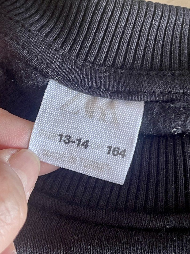 Zara Faux Layered Sweatshirt (Category: Longsleeves) located in San Juan City. Submitted by rike_ramirez (Listing ID 1466869427, Image 3). Description: - Style: Neat preppy layered design with front buttons - Color: Black sweatshirt with white shirt hem - teen Size: 13-14 years / 164 cm - Features: Long sleeves, ribbed cuffs, and neckline - Condition: Clean, well-kept, and comfy for daily wear.