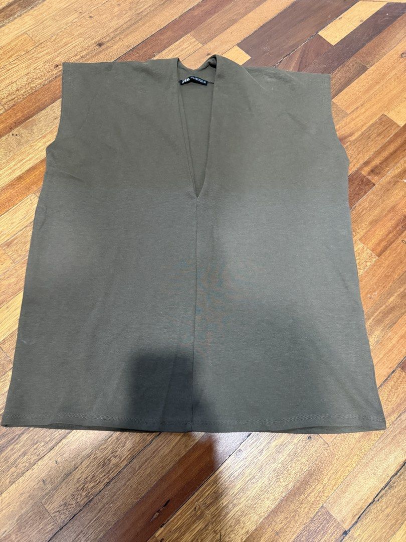 Zara Loose Deep V Neck Olive Green Blouse (Category: Blouses) located in Iloilo. Submitted by dabyladaby2 (Listing ID 1466777801, Image 1). Description: Shoulder-58cm Chest—53cm Length-72cm Store bought.