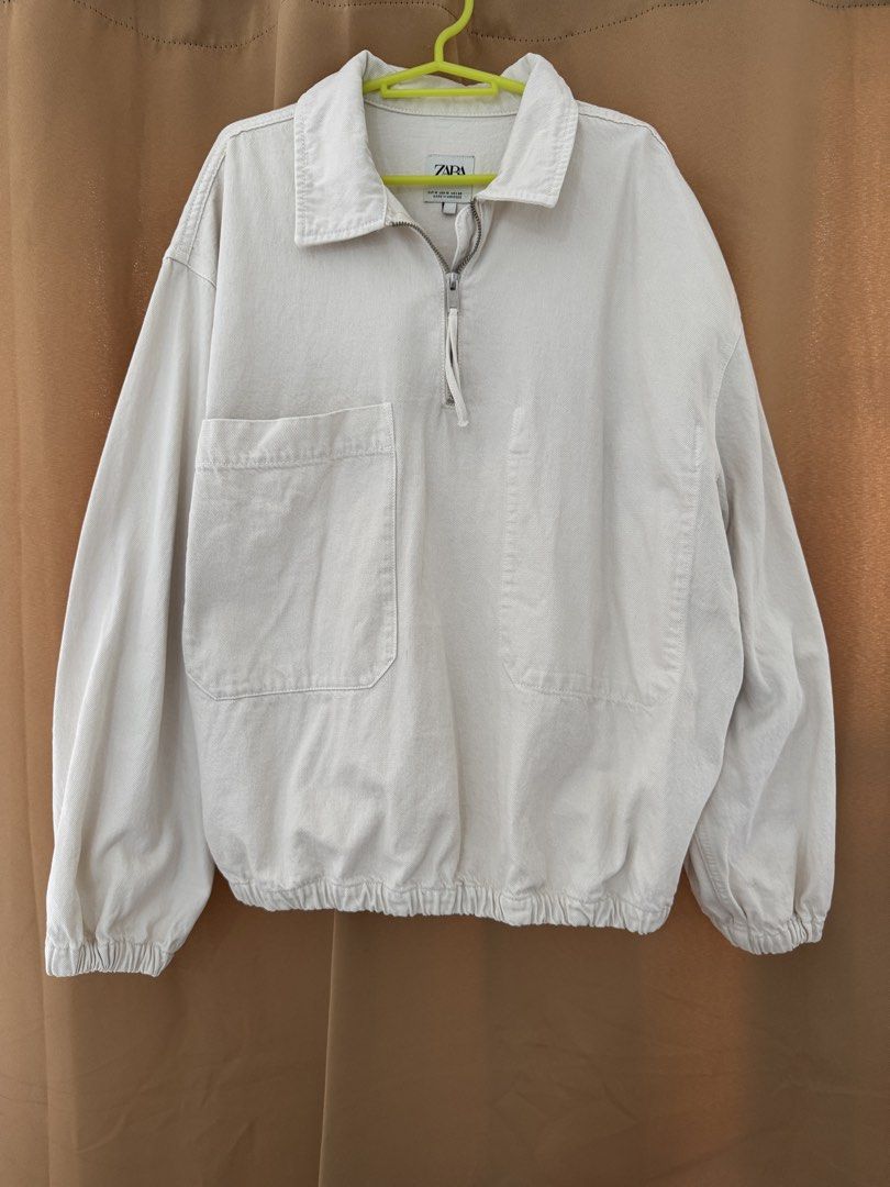 Zara Off-White Quarter Zip Denim Jacket Size M (Category: Coats, Jackets and Outerwear) located in Manila. Submitted by noblephoenix-8959 (Listing ID 1466819185, Image 1). Description: - Brand/Model: Zara Jacket - Size: Medium - Color: Off-white / Clean neutral tone - Material: Sturdy cotton denim (Made in Morocco) - Design: Quarter-zip front with collar and double chest pocket - Fit: Relaxed fit with elasticated hem and cuffs - Style: Perfect fo