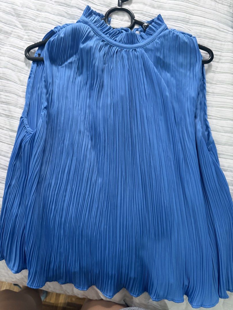 Zara Pleated Blue Sleeveless Blouse XS (Category: Sleeveless) located in Quezon City. Submitted by afternoonstore (Listing ID 1466844591, Image 1). Description: - Brand: Zara - Size: XS (fits true to size) - Color: Bright blue - Design: All-over pleats, high neckline with ruffled collar - Origin: Made in Turkey - Condition: Clean, worn only a couple of times - Ideal for: Summer wear or layering under blazers.