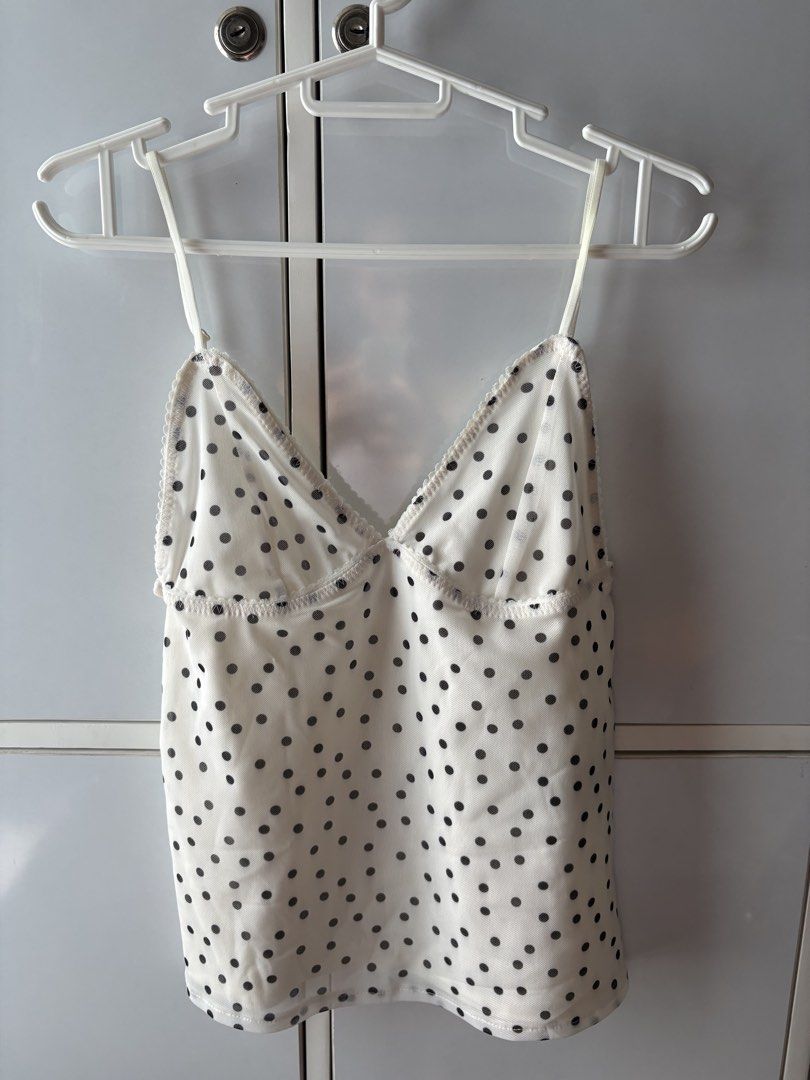 Zara Polka Dot Mesh Camisole Top (Category: Sleeveless) located in Manila. Submitted by jodi.declutters (Listing ID 1466784203, Image 1). Description: - Brand: Zara - SRP 1395 - Size: S (True to size) - Color: White with black polka dots - Material: Sheer mesh - Details: Adjustable spaghetti straps, sweetheart neckline, delicate scalloped lace trim - Origin: Made in Turkey - Style: Perfect for layering or wearing on its own.