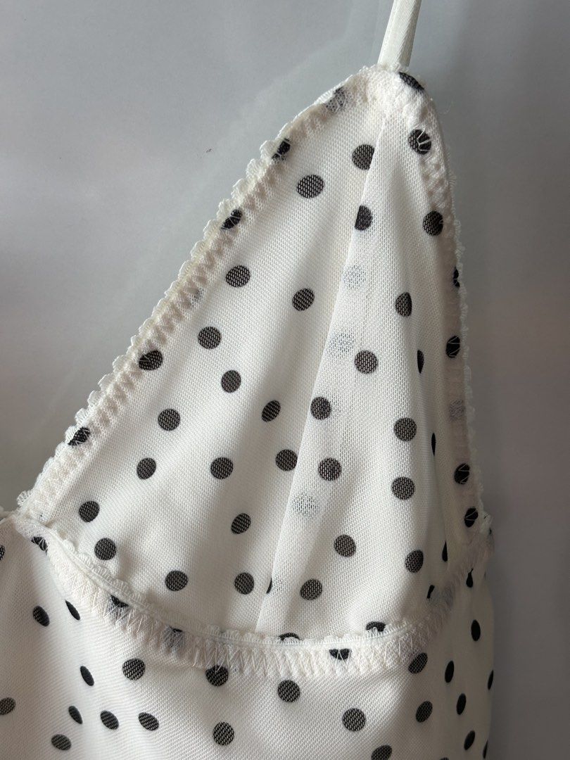 Zara Polka Dot Mesh Camisole Top (Category: Sleeveless) located in Manila. Submitted by jodi.declutters (Listing ID 1466784203, Image 2). Description: - Brand: Zara - SRP 1395 - Size: S (True to size) - Color: White with black polka dots - Material: Sheer mesh - Details: Adjustable spaghetti straps, sweetheart neckline, delicate scalloped lace trim - Origin: Made in Turkey - Style: Perfect for layering or wearing on its own.