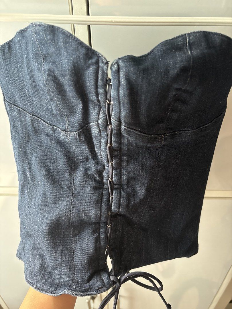 Zara TRF Denim Corset Top (Category: Sleeveless) located in Manila. Submitted by jodi.declutters (Listing ID 1466782995, Image 2). Description: - Brand: Zara - ONCE USED - SRP 2395 - Size: XS - Color: Dark blue denim - Fit: Structured with sweetheart neckline - Closure: Front metal hook-and-eye with lace detail & full-length back zipper - Origin: Made in Morocco - Style: Y2K, easy to pair with cargos or skirts.