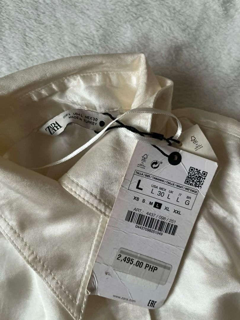 Zara white satin wrap dress (Category: Dresses) located in Pasig City. Submitted by closet_reframe (Listing ID 1466779850, Image 3). Description: Brand new, Zara white satin wrap dress. Satin fabric has a smooth feel and nice flow when worn. Clean finish with well-made stitching and a flattering wrap design. with tags. Shoes are also for sale! S: L.