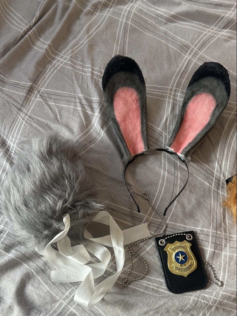 Zootopia Nick Wilde and Judy Hopps Set (Category: Sets or Coordinates) located in Makati City. Submitted by markopolo_preloved (Listing ID 1466860560, Image 3). Description: - Complete Zootopia couple cosplay set: Nick Wilde & Judy Hopps - Nick: Fox Ears & Tail (purchased at ₱926) - Judy: Bunny Ears & Tail (purchased at ₱905) - Judy Police badge (purchased at ₱138) - Total ₱1,969 but selling all for only ₱1,299 - Save ₱670 - Material: Soft faux f