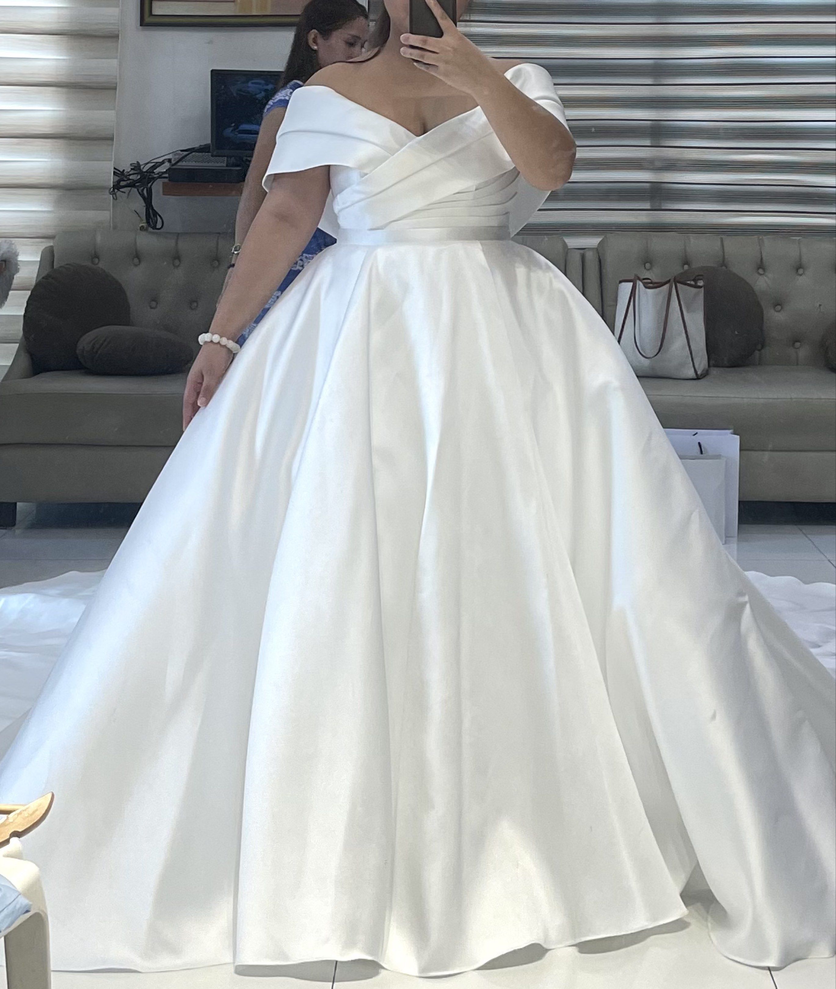 2 Way Off-Shoulder Wedding Gown (Category: Evening dresses & gowns) located in Las Pinas. Submitted by jynnette (Listing ID 1418997966, Image 2). Description: - Dry cleaned - Two way with petticoat - Mikado tela - See photos for exact measurements - Off-shoulder minimalist wedding gown - Features a fitted bodice and flowing train - Full, floor-length skirt - Smooth, white fabric - Designed by Dandy Temporosa Couture - Ideal for a classic and soph
