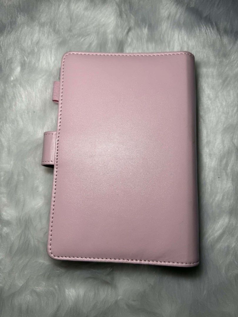 A6 Pink Binder Organizer with Cash Envelopes (Category: Stationery & School Supplies) located in Manila. Submitted by abcdcv (Listing ID 1419126043, Image 3). Description: - A6 Pink binder organizer - With free ballpen‼️ - With free 12 snap closure envelopes - Ring binder mechanism - Clear pockets for organization - Smooth, solid pink exterior - Compact size.
