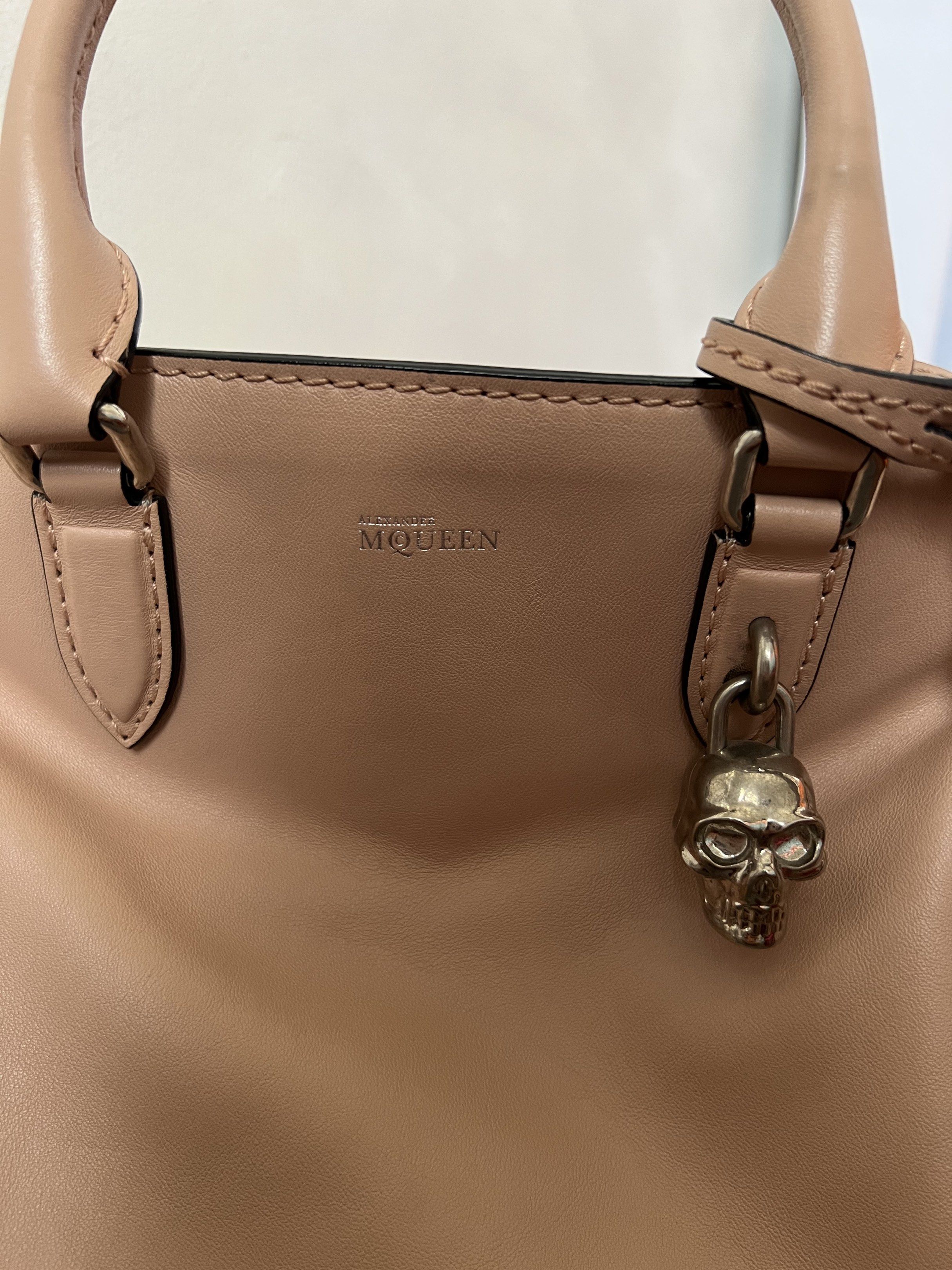 Alexander McQueen Padlock Satchel (Category: Luxury Bags & Wallets) located in Quezon City. Submitted by kdiv_ (Listing ID 1419030736, Image 3). Description: Personal preloved | Guaranteed Authentic Bought in Saks Fifth NYC Small in Pink, Calkskin Leather Inclusions: Dust bag and Strap RFS: Decluttering, no longer being used MOP: BDO/GCash Shipping fee to be shouldered by the buyer.