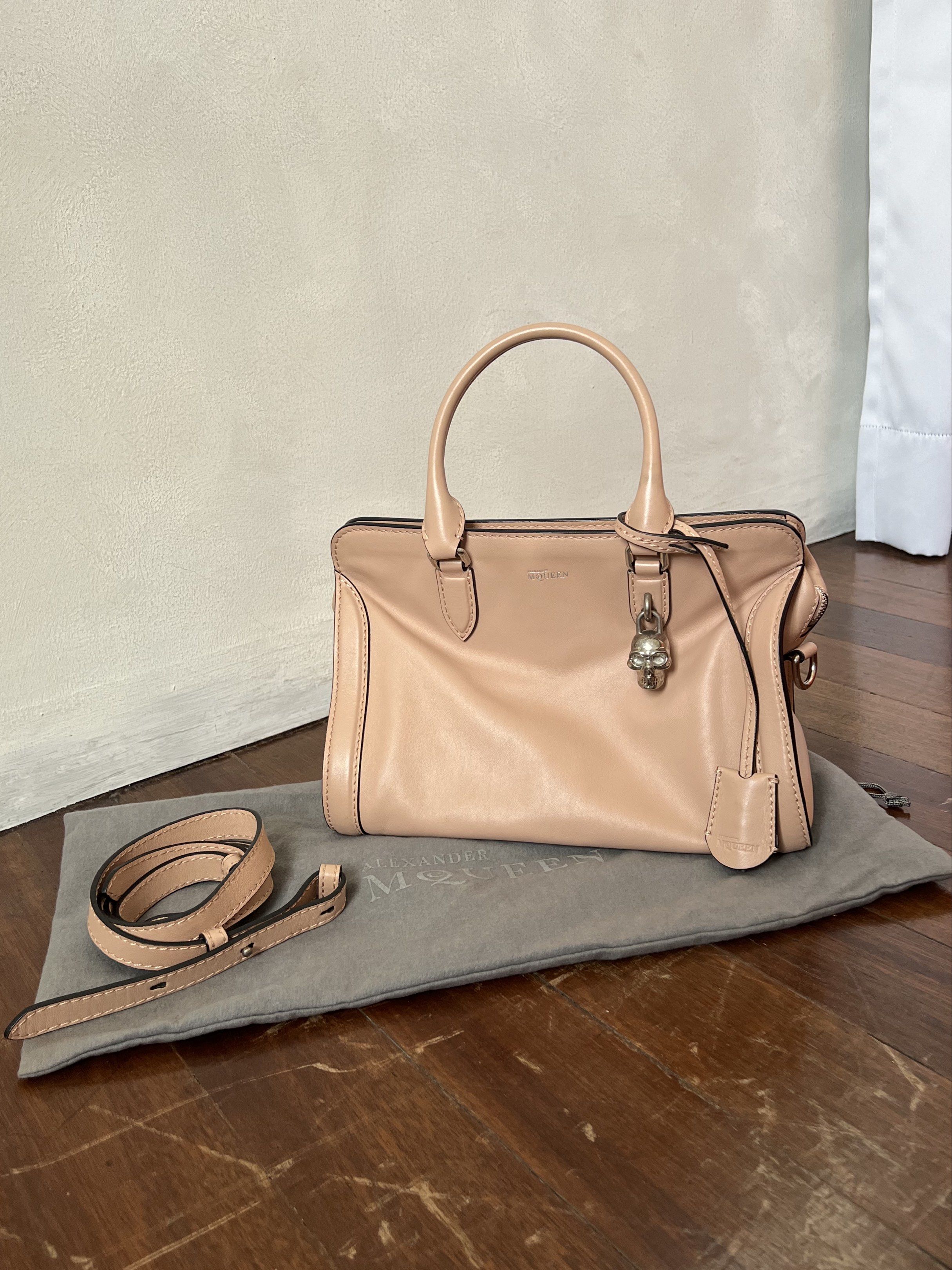 Alexander McQueen Padlock Satchel (Category: Luxury Bags & Wallets) located in Quezon City. Submitted by kdiv_ (Listing ID 1419030736, Image 1). Description: Personal preloved | Guaranteed Authentic Bought in Saks Fifth NYC Small in Pink, Calkskin Leather Inclusions: Dust bag and Strap RFS: Decluttering, no longer being used MOP: BDO/GCash Shipping fee to be shouldered by the buyer.