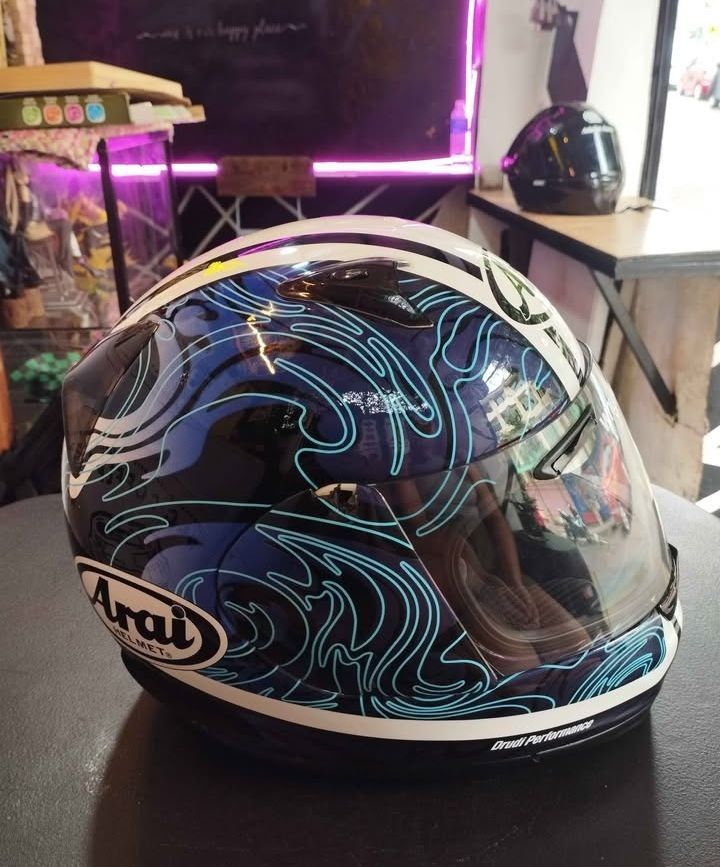 Arai Profile Riptide Helmet (Category: Helmets and other Riding Gears) located in Manila. Submitted by luxurybagmanila (Listing ID 1418984033, Image 3). Description: - Arai Profile Riptide helmet - Features a dark visor - Unique graphic design - Sleek, aerodynamic shape - Brand and model clearly visible - issue minor chips/dents .