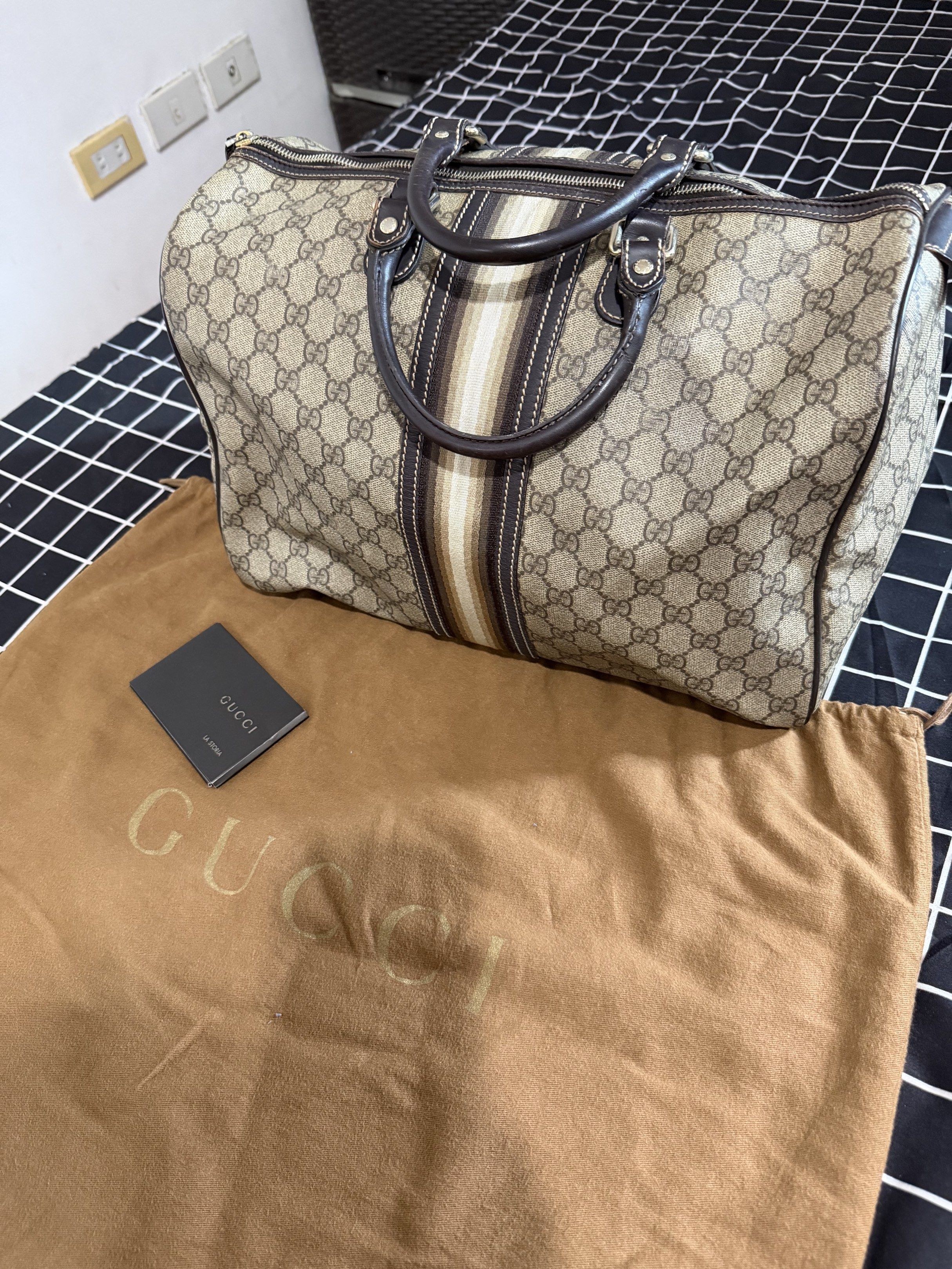 Authentic Gucci Boston Doctors Bag Size 35 (Category: Luxury Bags & Wallets) located in Pasig City. Submitted by melay420 (Listing ID 1419054563, Image 3). Description: Authentic Vintage Boston Doctors Handbag With Gigi Monogram Print Complete with original dust bag and manual. Selling as is with signs of use..