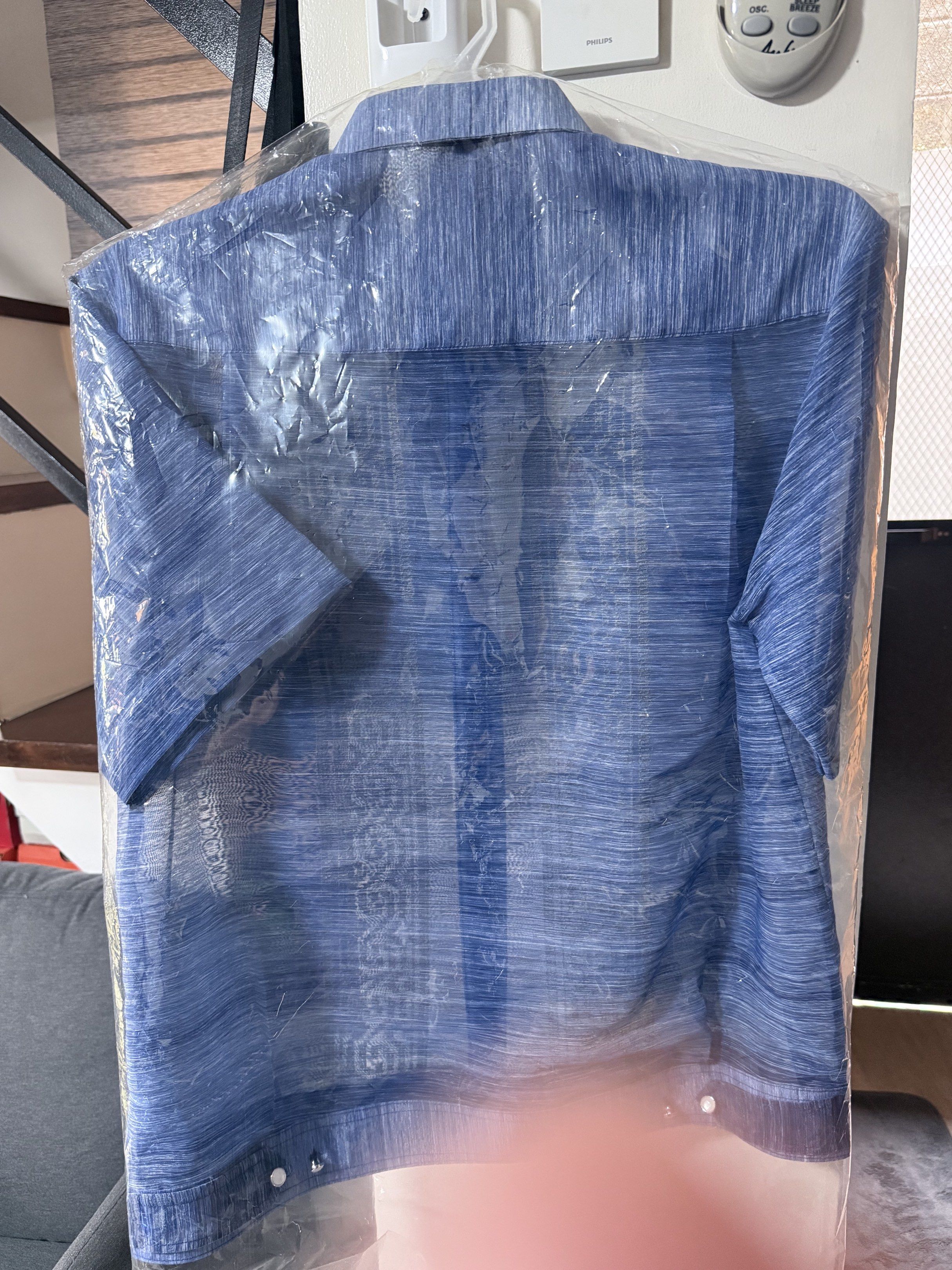 Barong Lumban (Category: Others Tops) located in Mandaluyong City. Submitted by wanderoot (Listing ID 1418976972, Image 3). Description: Used only once (Christmas Party) Bought for 5,000 plus - Blue short-sleeved shirt - Button-down front - Collared neckline - Textured fabric - Clean and well-maintained - Comes in a garment bag.