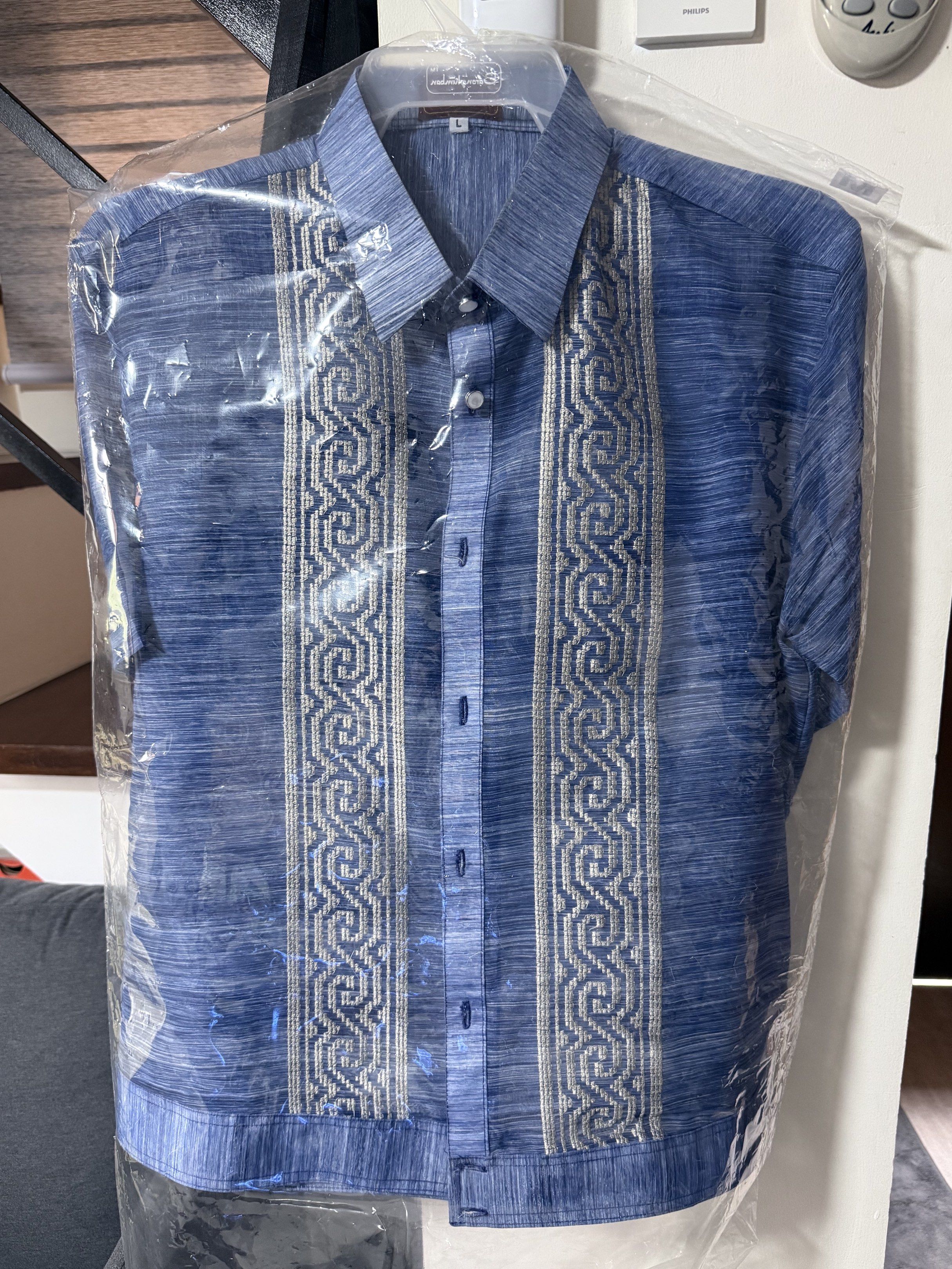 Barong Lumban (Category: Others Tops) located in Mandaluyong City. Submitted by wanderoot (Listing ID 1418976972, Image 1). Description: Used only once (Christmas Party) Bought for 5,000 plus - Blue short-sleeved shirt - Button-down front - Collared neckline - Textured fabric - Clean and well-maintained - Comes in a garment bag.