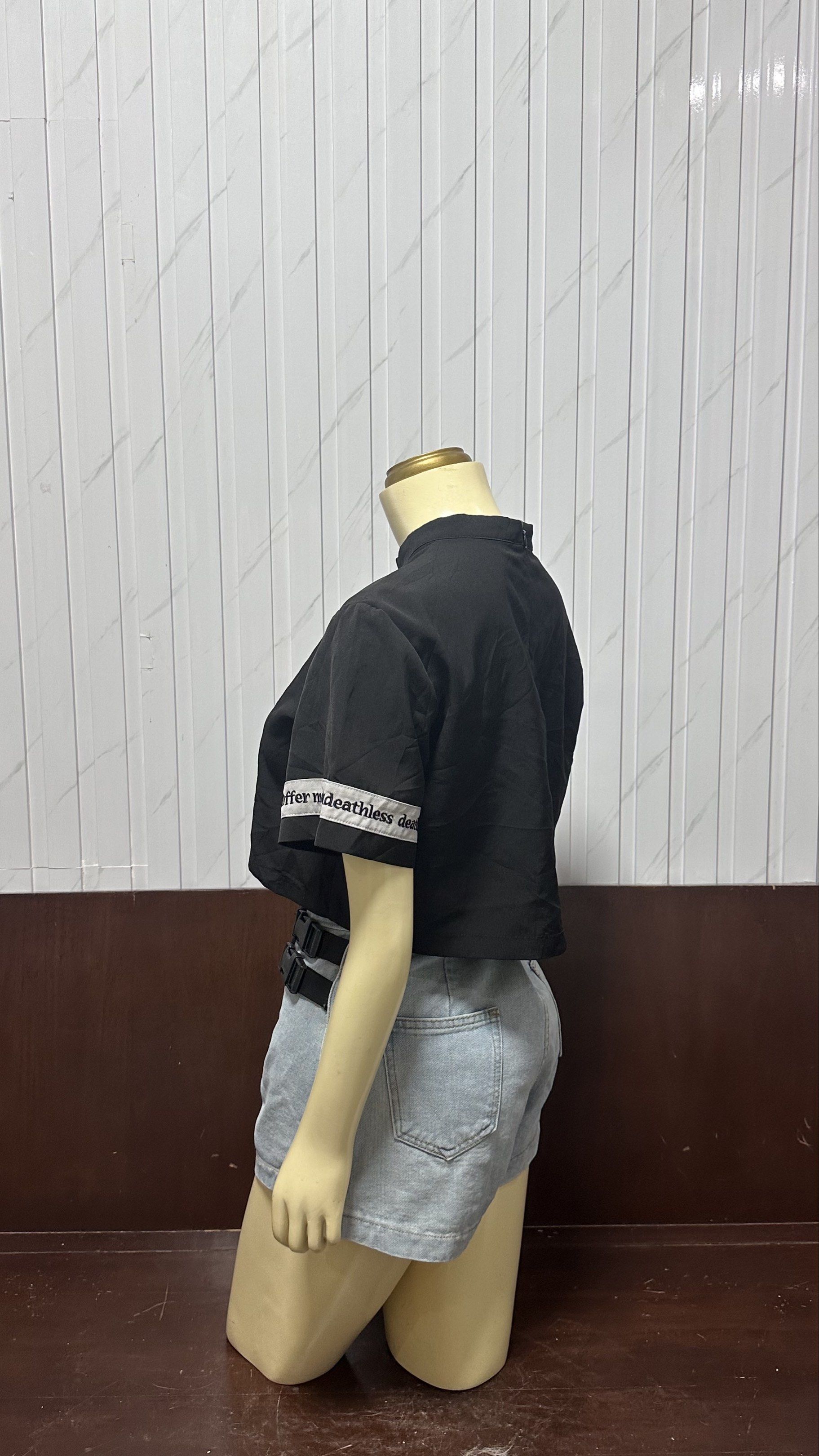 Black Crop Top (Category: Sets or Coordinates) located in Taguig. Submitted by ylluhhhh (Listing ID 1419192209, Image 2). Description: - Black crop top with white cross design and text on sleeves - High collar - Denim shorts with wrap-around design - Light wash - Includes black belt - Fashionable and ready-to-wear.
